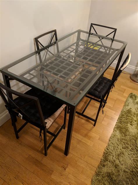 Or grab a handy tray to visually group items you want to display. . Ikea glass dining table